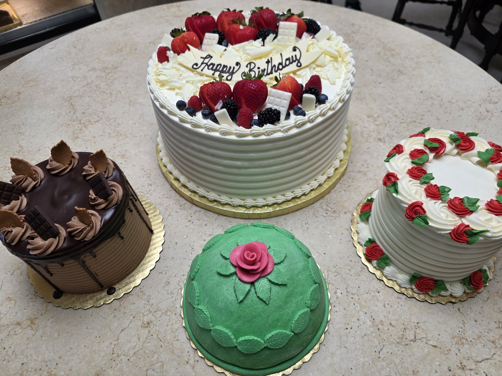 Celebration cakes from Mikkelsen’s Pastry Shop on the bakery counter.